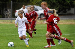 Jenna running with soccer ball